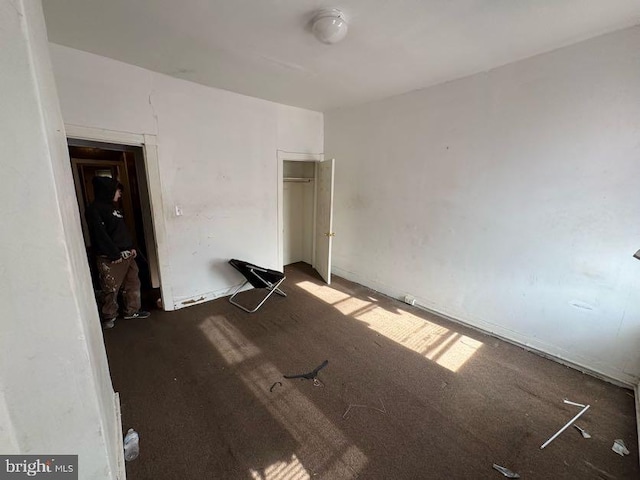 unfurnished bedroom featuring a closet