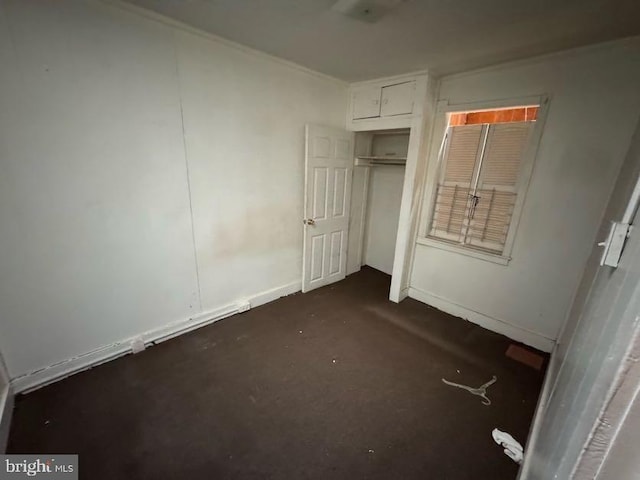 unfurnished bedroom with a closet