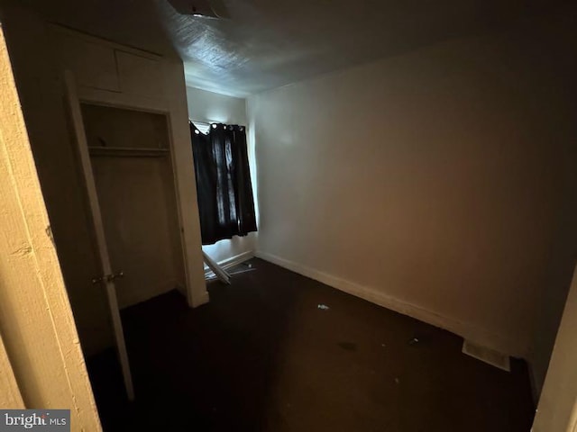 unfurnished bedroom with a closet