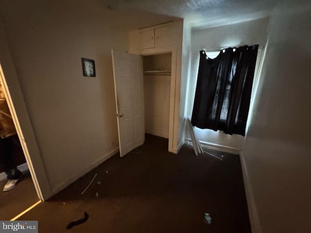 unfurnished bedroom with a closet