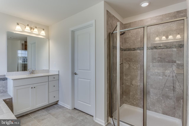 bathroom featuring vanity and an enclosed shower