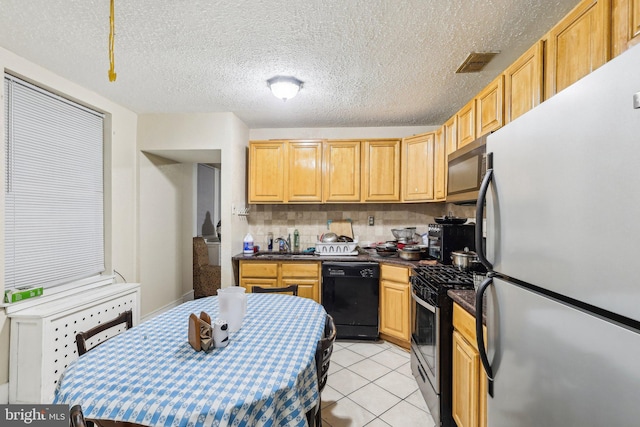 kitchen featuring light brown cabinetry, stainless steel appliances, backsplash, light tile patterned floors, and sink