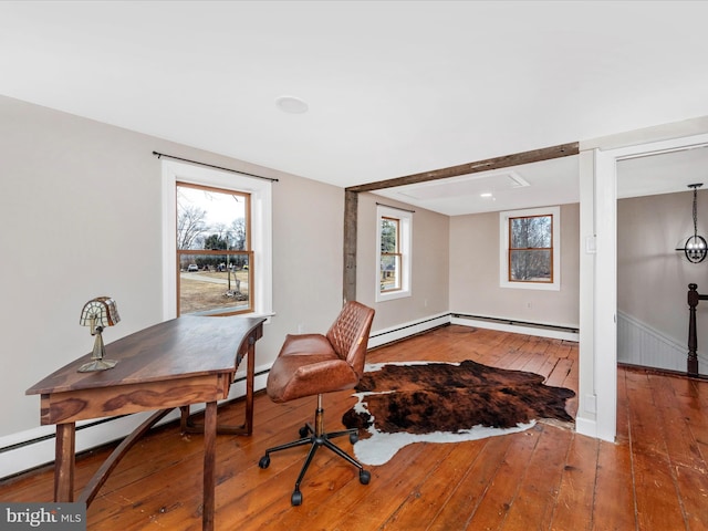 office featuring hardwood / wood-style floors and a baseboard heating unit