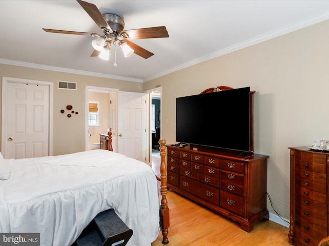 bedroom with crown molding, ceiling fan, and light hardwood / wood-style flooring