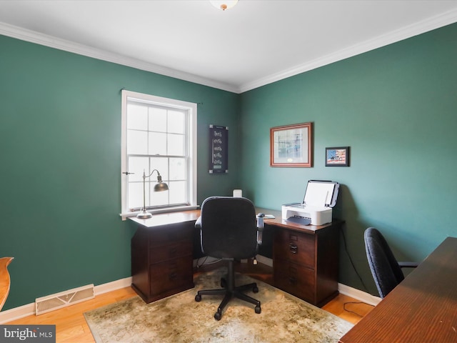 office space featuring ornamental molding and light wood-type flooring