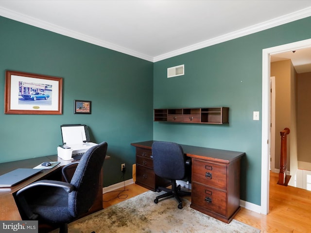 office space with crown molding and light hardwood / wood-style floors