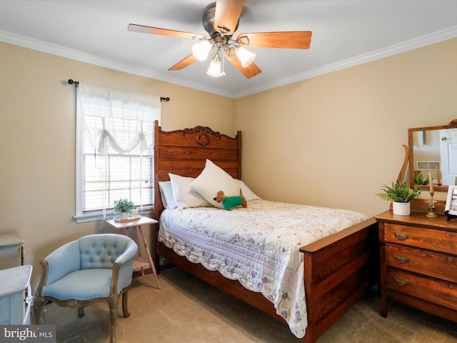 carpeted bedroom with ceiling fan and ornamental molding