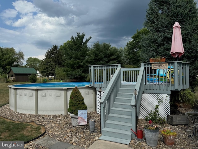 view of pool featuring a wooden deck