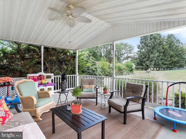 sunroom / solarium with vaulted ceiling and ceiling fan