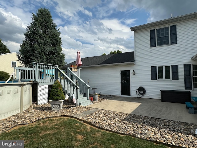 back of property with a patio area