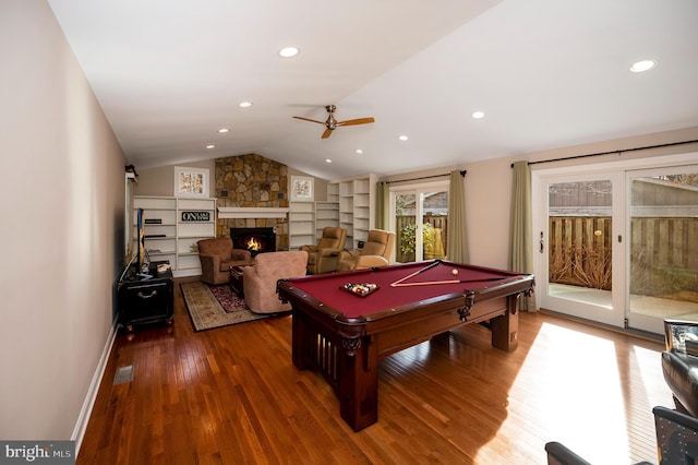 rec room with lofted ceiling, billiards, a fireplace, wood-type flooring, and built in shelves