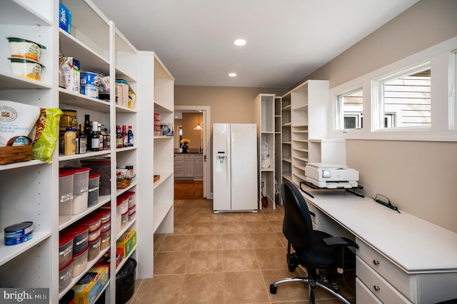 home office with light tile patterned flooring