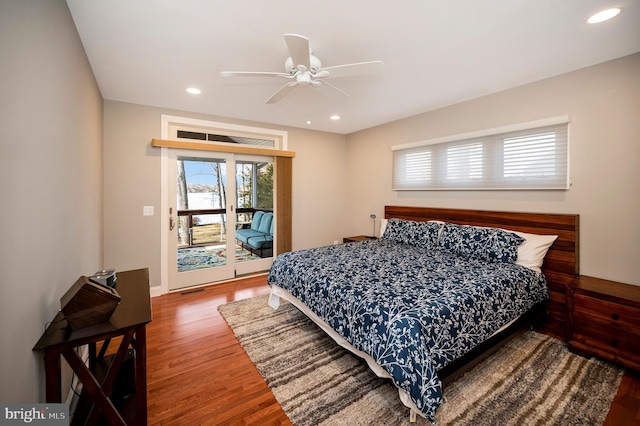 bedroom featuring hardwood / wood-style flooring, access to exterior, and ceiling fan