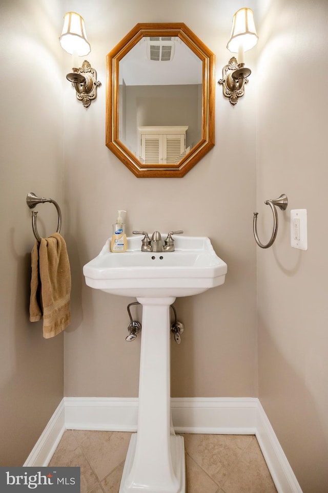 bathroom with tile patterned flooring