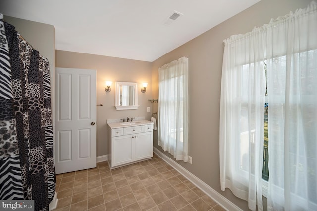 bathroom featuring tile patterned floors and vanity