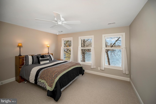 carpeted bedroom with ceiling fan