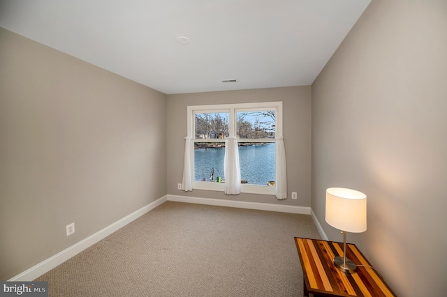 empty room with carpet flooring