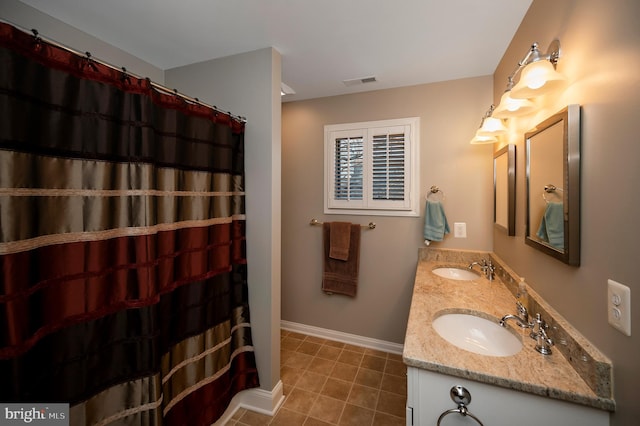 bathroom featuring vanity and tile patterned flooring