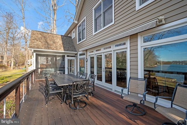 wooden deck with a water view