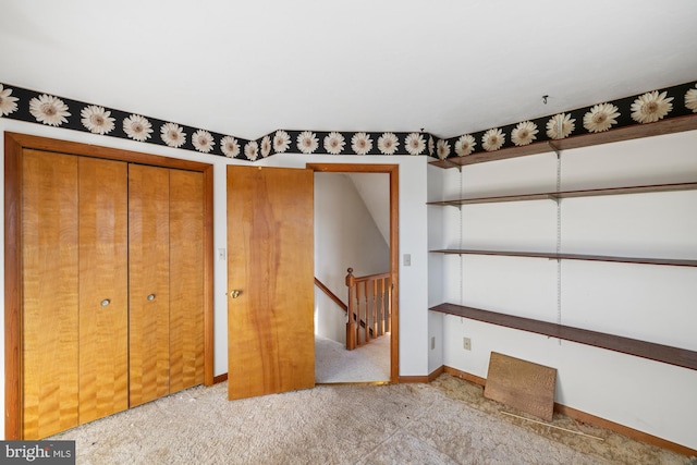 unfurnished bedroom featuring light carpet