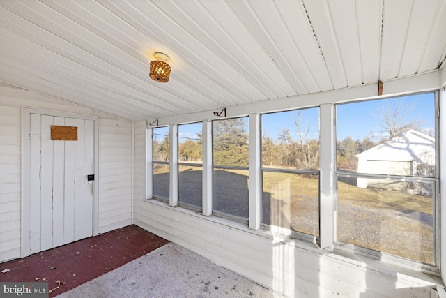 unfurnished sunroom with vaulted ceiling