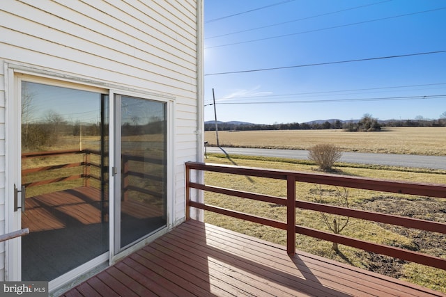 wooden terrace with a rural view