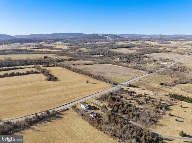 birds eye view of property with a mountain view and a rural view