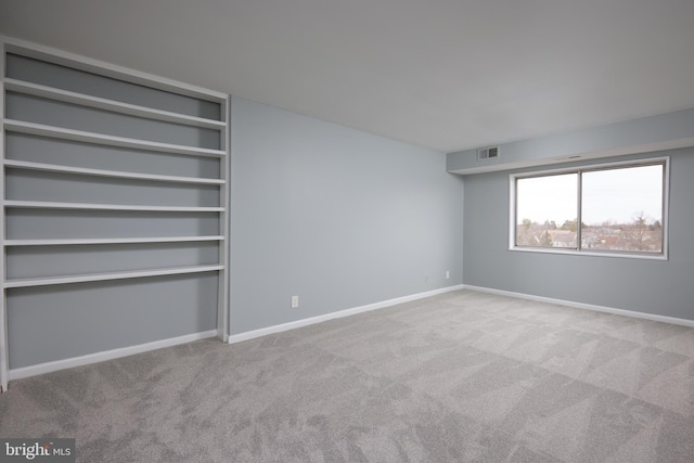 spare room with light colored carpet