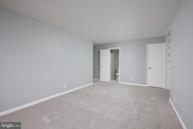 spare room with light colored carpet