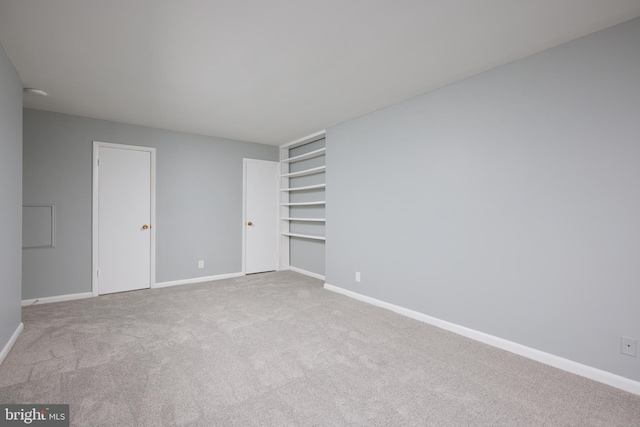 unfurnished bedroom with light carpet