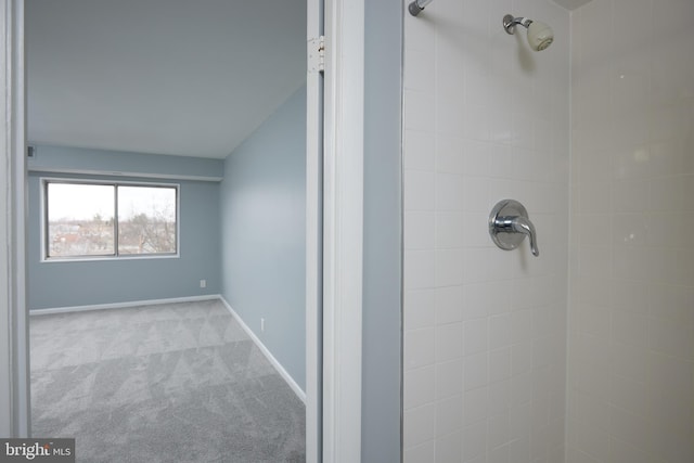 bathroom with a tile shower