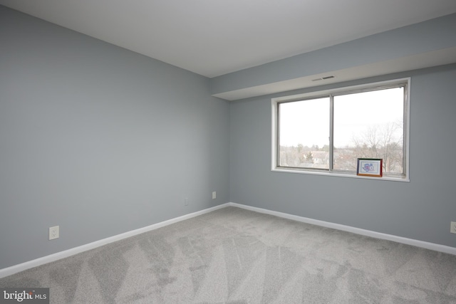 view of carpeted spare room