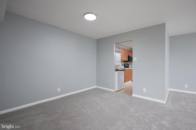 spare room with light colored carpet