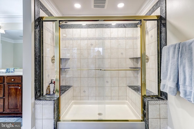 full bathroom featuring vanity, visible vents, recessed lighting, a stall shower, and ornamental molding