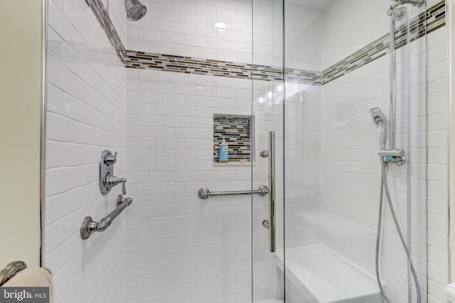 bathroom featuring a shower stall