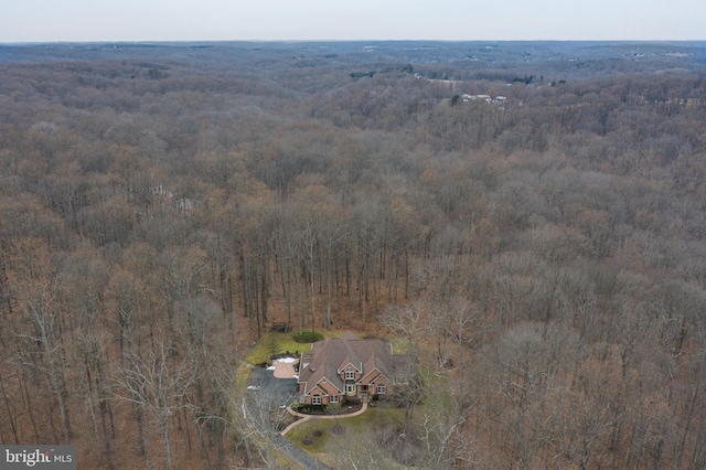 bird's eye view featuring a forest view