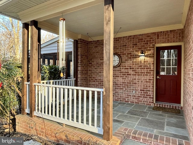 property entrance with covered porch