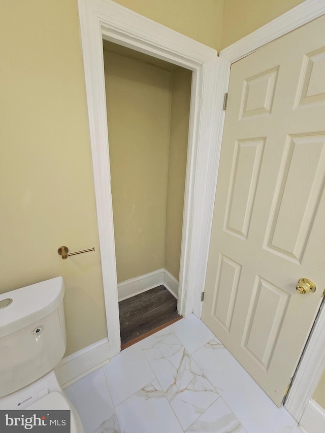 bathroom featuring toilet