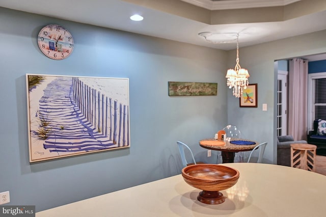 dining space featuring a notable chandelier