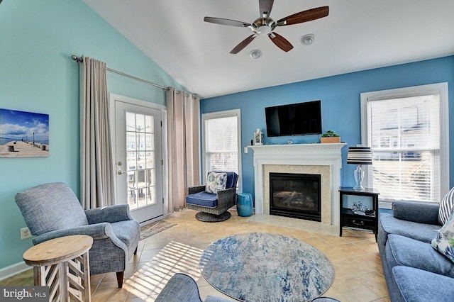 living room featuring lofted ceiling, a wealth of natural light, and light tile patterned floors