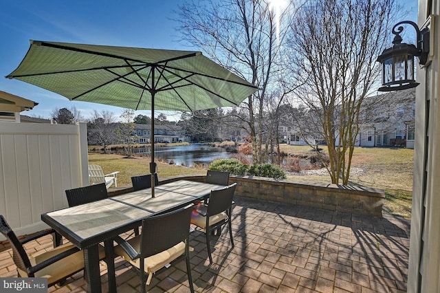 view of patio featuring a water view