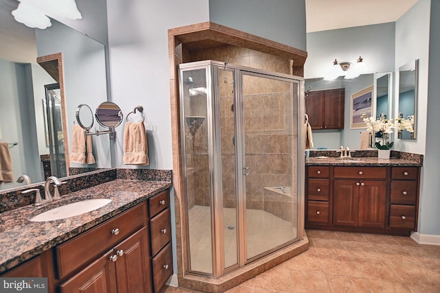 bathroom featuring vanity and a shower with shower door