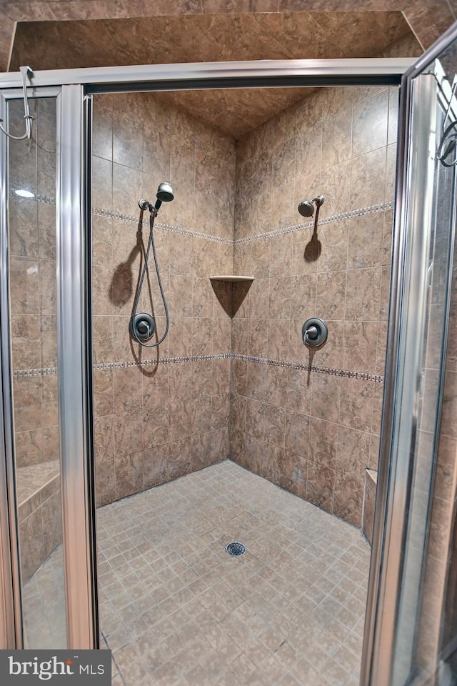 bathroom featuring an enclosed shower