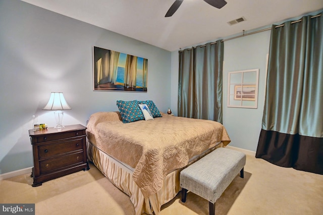 bedroom featuring light colored carpet and ceiling fan