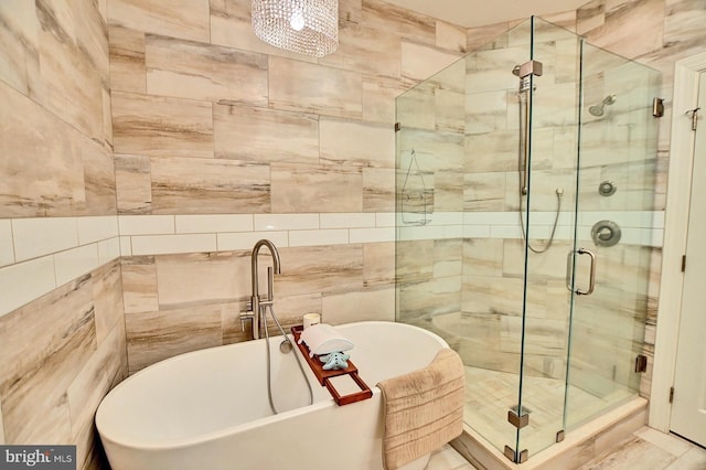 bathroom with shower with separate bathtub