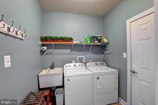 washroom featuring sink and washer and clothes dryer