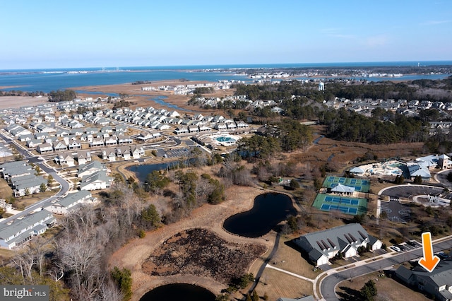 birds eye view of property featuring a water view