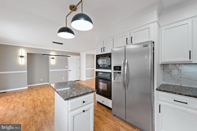 kitchen with white cabinetry, tasteful backsplash, black appliances, decorative light fixtures, and dark stone counters