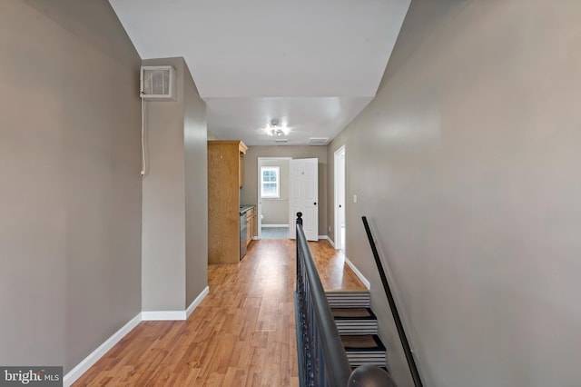 hall with light hardwood / wood-style floors