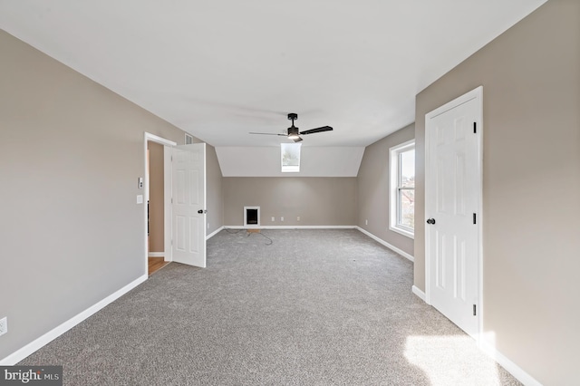 bonus room with ceiling fan, vaulted ceiling, and carpet